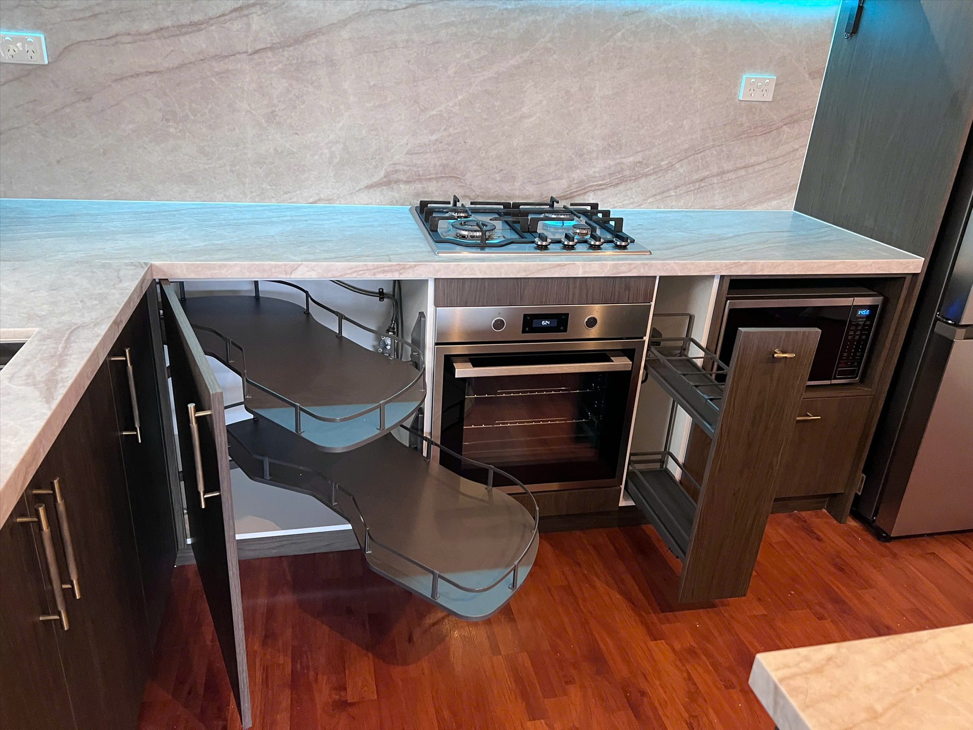 Corner storage and narrow pull-out storage in a custom kitchen